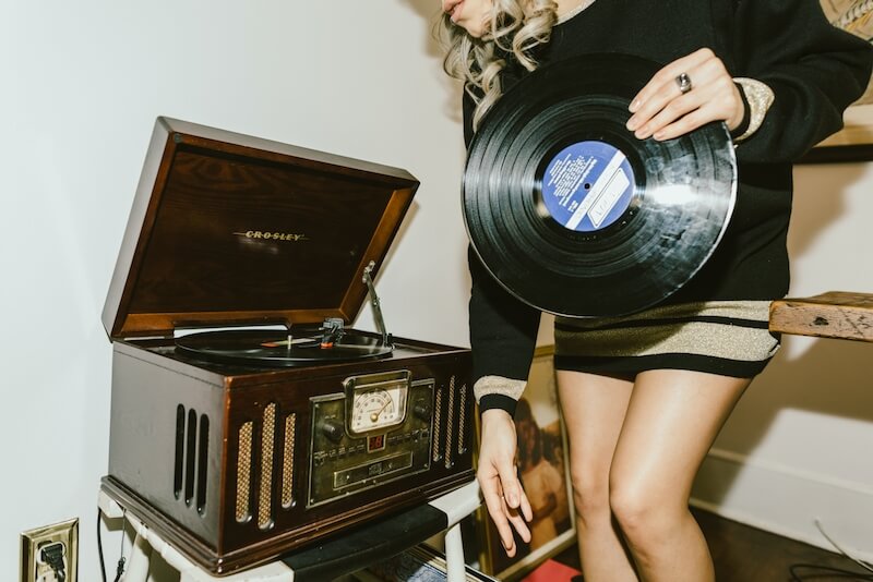 A woman holding a record.
